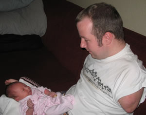 Hannah McDoniel cuddling with her handicapped dad, Chet McDoniel